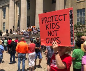 Sign reading: Protect Kids not Guns